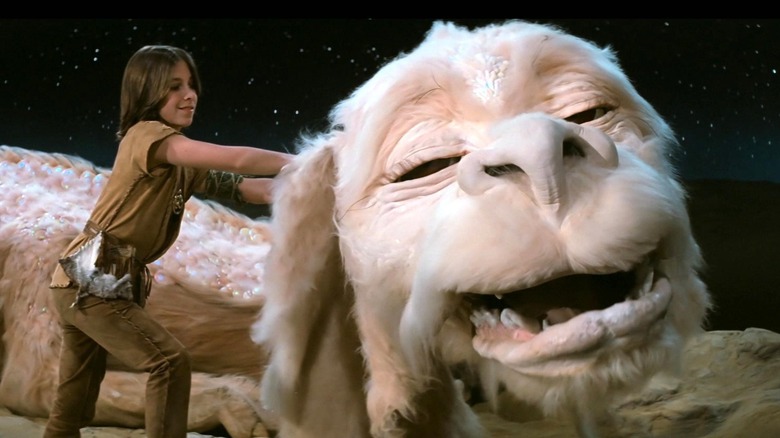 Atreyu patting Falcor in The NeverEnding Story