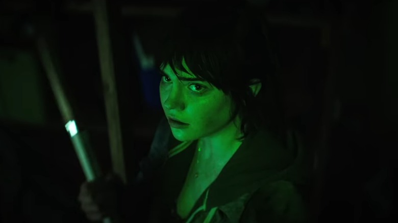 Sophie Thatcher as Sadie, lit green in a basement, in The Boogeyman