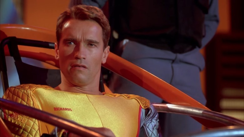 Arnold Schwarzenegger as Ben Richards in his yellow suit, in The Running Man