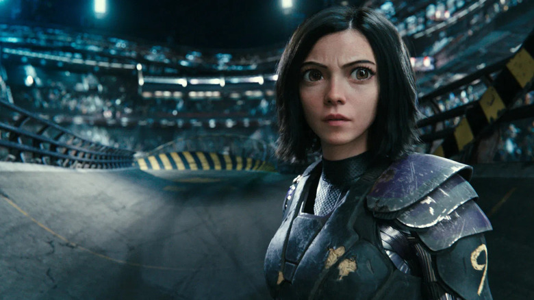 Alita staring intensely on battlefield in Alita: Battle Angel