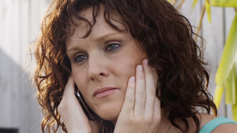 Lee-Anne talks on phone