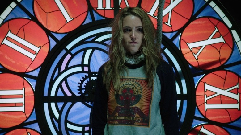 Tree stands in front of a stain glass window in Happy Death Day