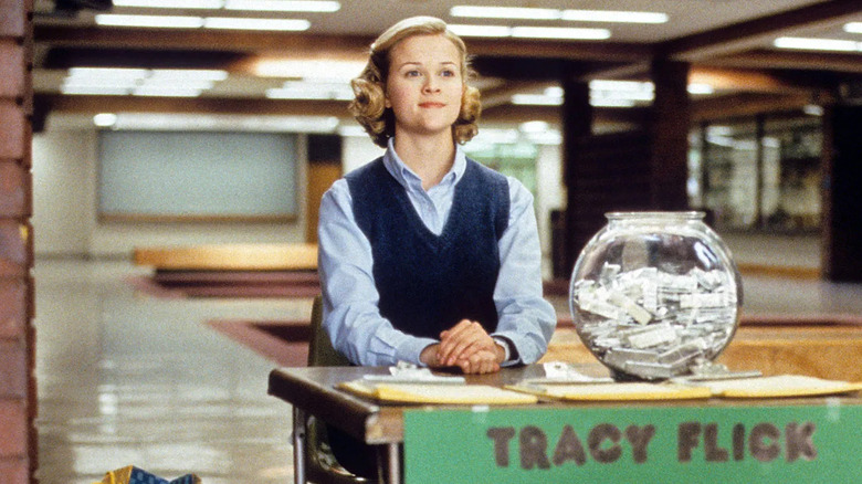 Tracy sitting at her campaign desk in an empty hallway in Election