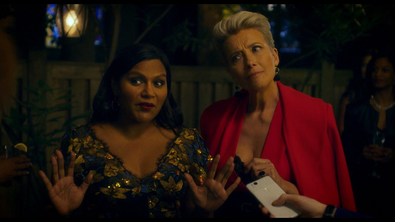 Molly and Katherine talking to someone and looking baffled in Late Night