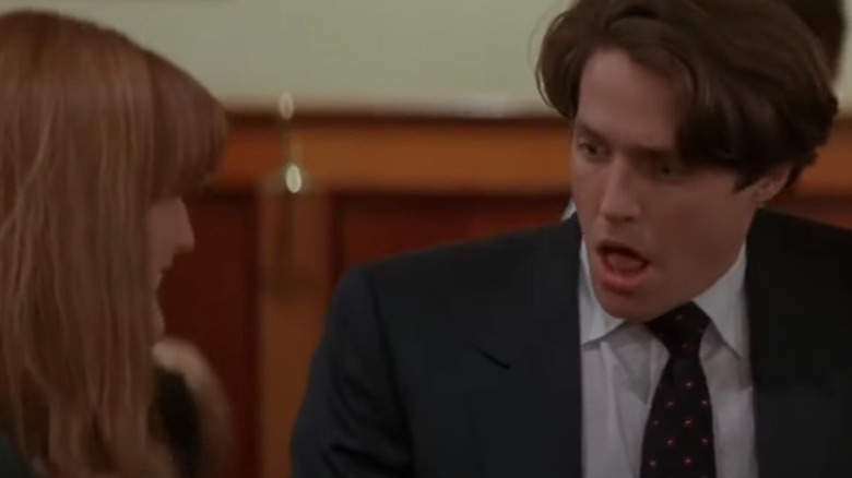 Hugh Grant as Samuel in Nine Months looks at Julianne Moore's character Rebecca in shock