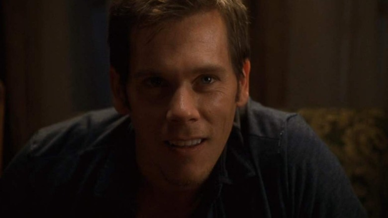 Kevin Bacon as Tom, being hypnotized in Stir of Echoes