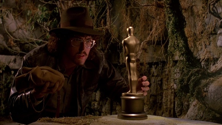 Weird Al Yankovic dressed as Indiana Jones, about to steal an Oscar, in UHF