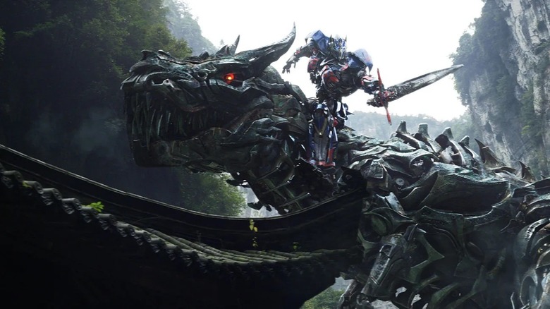 Optimus Prime riding Grimlock in Transformers: Age of Extinction (2014)