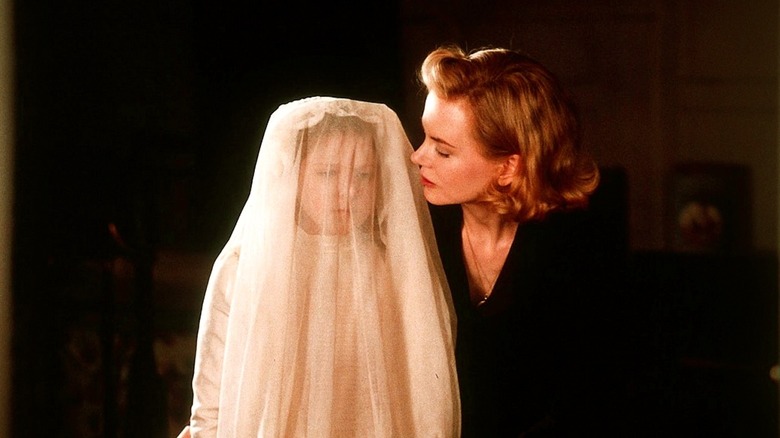 Grace looking at daughter Anne in white dress and veil