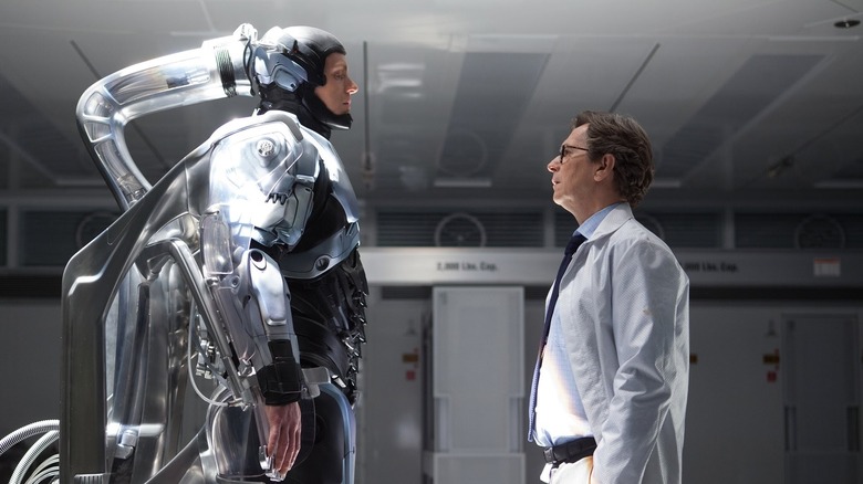 Dr. Dennett Norton addresses RoboCop in "RoboCop" (2014)