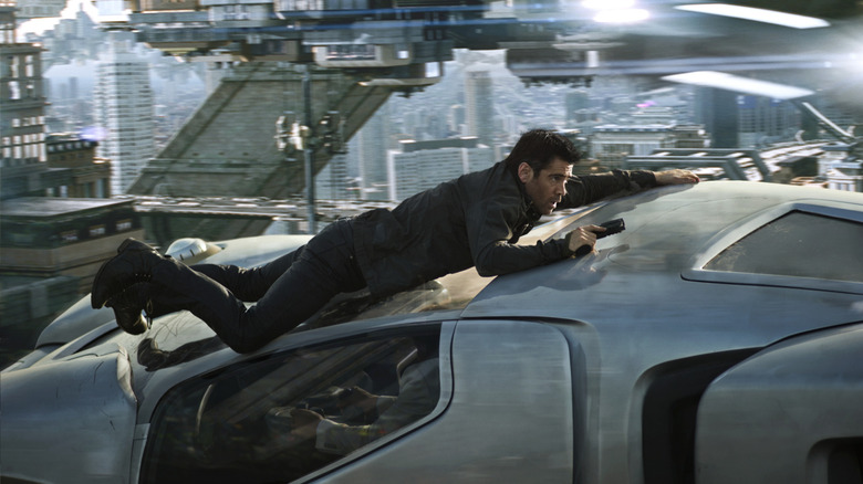 Carl Hauser hangs onto a flying car in "Total Recall" (2012)