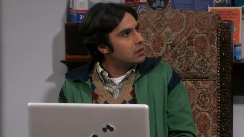 Raj sitting at his laptop with an angry expression in "The Big Bang Theory."