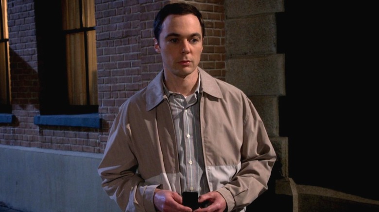 Sheldon frowning, holding a ring box, in "The Big Bang Theory."