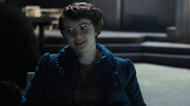 Barb sitting by the pool in "Stranger Things"