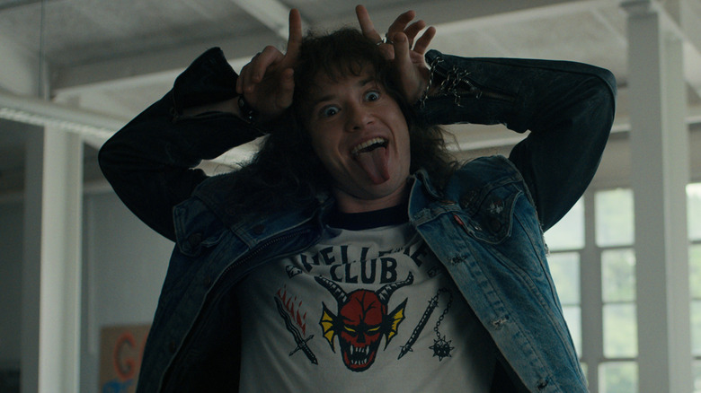 Eddie making devil horns in 