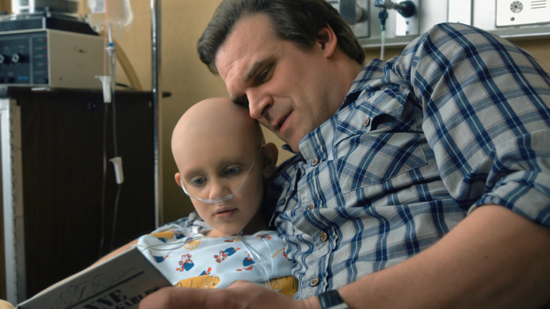 Hopper reading a book to Sara in "Stranger Things"