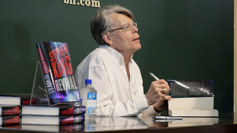 Stephen King signing copies of his book "Revival" (2014)