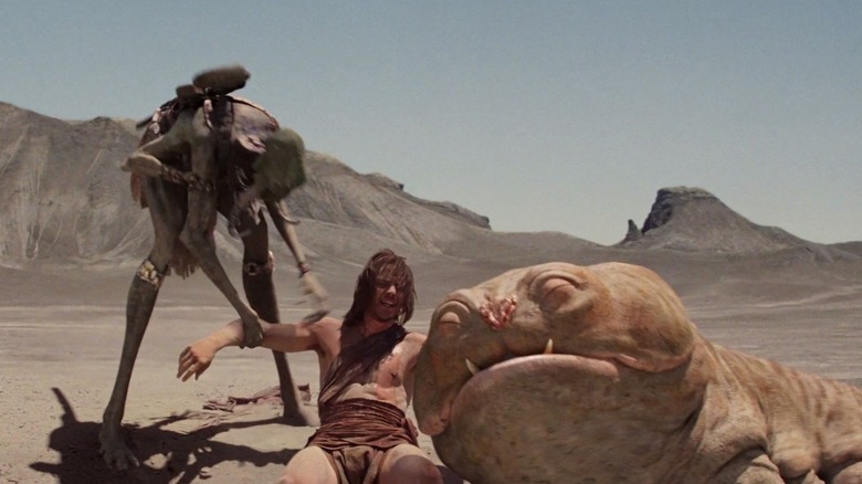 John Carter and Woola cuddling in John Carter (2012)