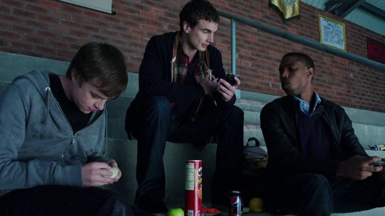 Andrew, Matt, and Steve sitting in the bleachers in Chronicle (2012)