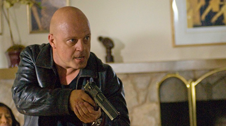 Michael Chiklis holding a gun
