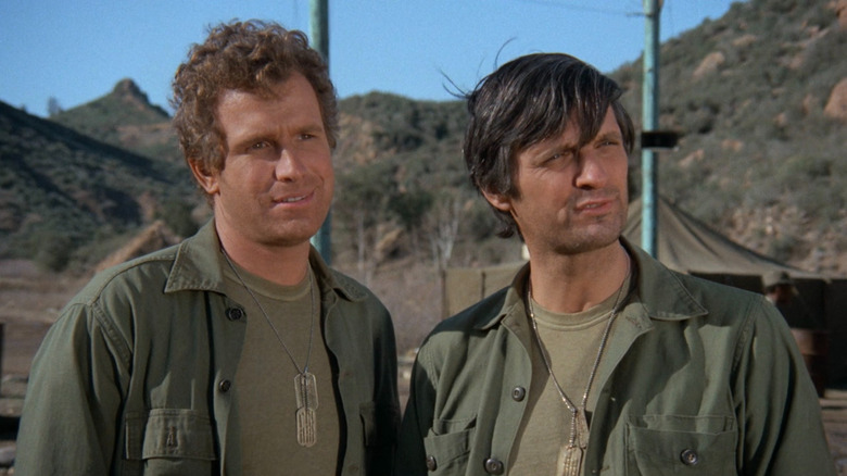 Hawkeye and Klinger staring ahead on "M*A*S*H"