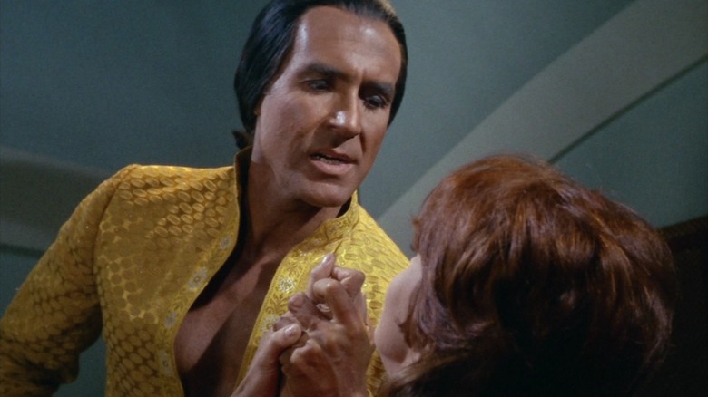 Khan Noonien Singh threatening a woman in "Star Trek"