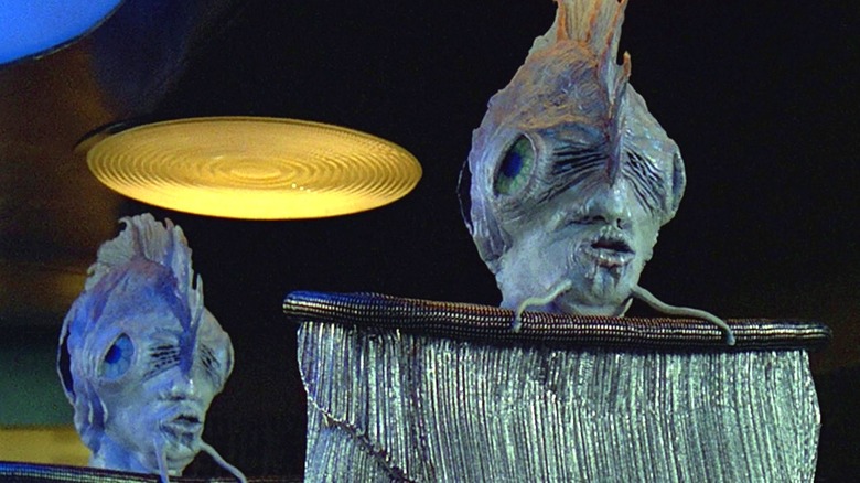 Mick Fleetwood as a blue alien in heavy makeup in Star Trek The Next Generation