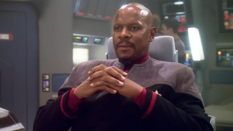 Sisko sits in the captain's chair in Star Trek: Deep Space Nine