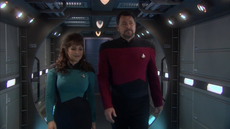 Troi and Riker walk through a corridor on Star Trek: Enterprise