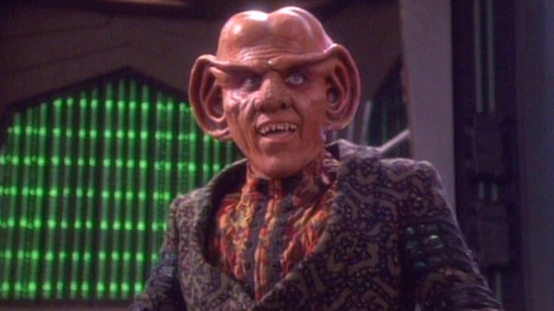 Quark smiles broadly in Star Trek: Deep Space Nine