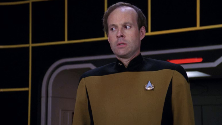 Barclay stands nervously on the holodeck in Star Trek: The Next Generation