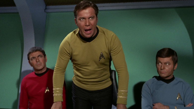 Kirk stands up from his seat and yells in Star Trek