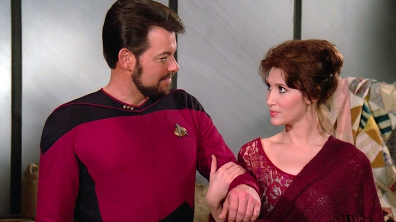 Brenna holds Riker's arm in Star Trek: The Next Generation