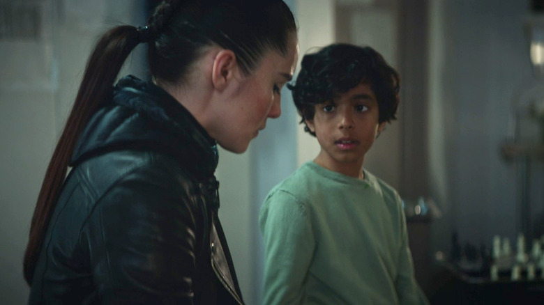 La'an sits with a child aged Khan in "Star Trek: Strange New Worlds" (2022-present)
