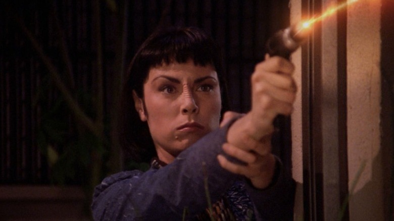 Ro fires a phaser in Star Trek: The Next Generation
