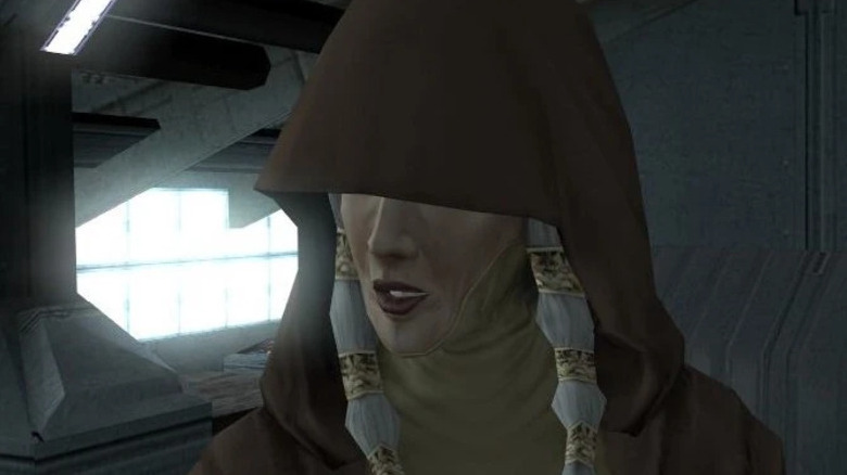 Kreia speaking on the Ebon Hawk with her hood pulled low over her eyes in Star Wars: Knights of the Old Republic
