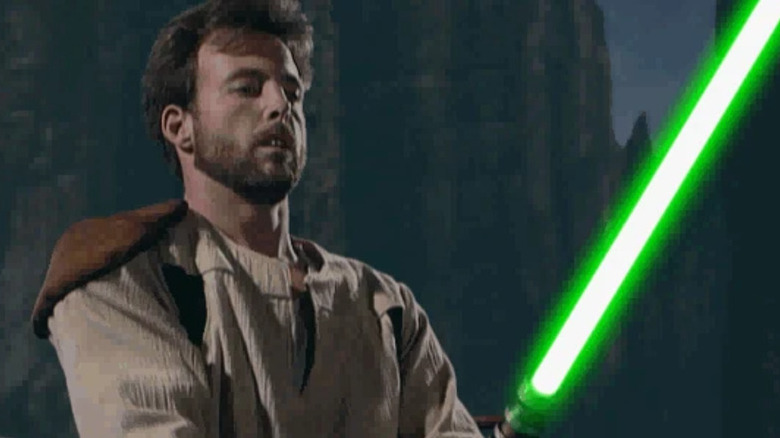 Kyle Katarn holding a green lightsaber in Star Wars Jedi Knight: Dark Forces II