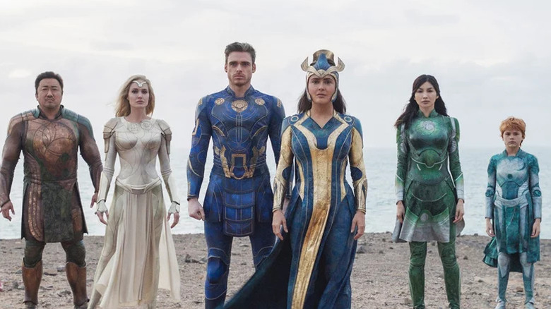 Gilgamesh, Thena, Ikaris,  Ajak,  Sersi, and Sprite on a beach in Eternals