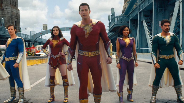 Shazam and his superhero siblings posing on bridge in Shazam! Fury of the Gods