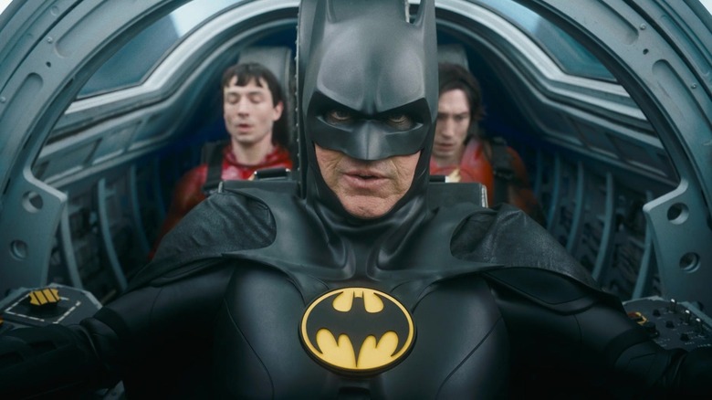 Batman flying the Batwing with both Barry Allens in The Flash