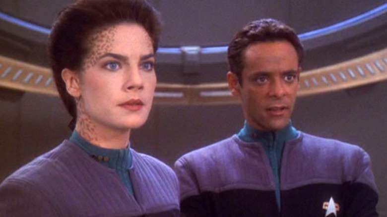 Dax and Bashir look concerned in Star Trek: Deep Space Nine