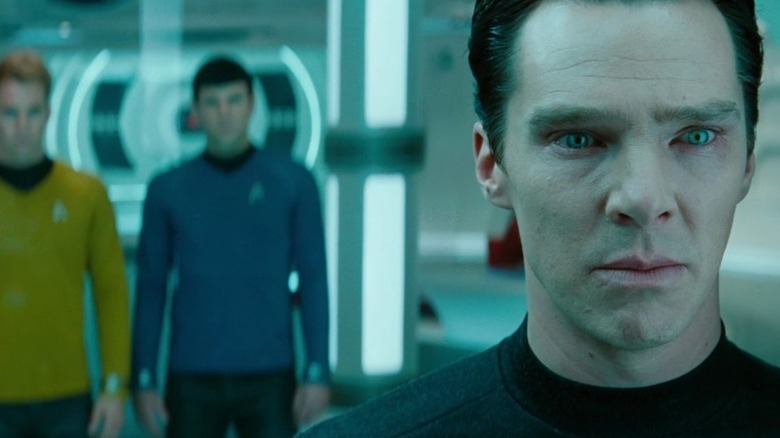 Kirk and Spock standing behind Khan in the brig in Star Trek Into Darkness