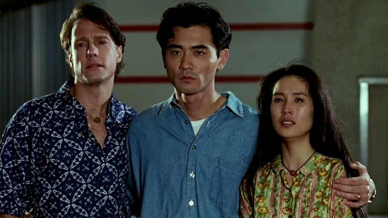 Simon, Gao, and Gu standing shoulder to shoulder in The Wedding Banquet (1993)