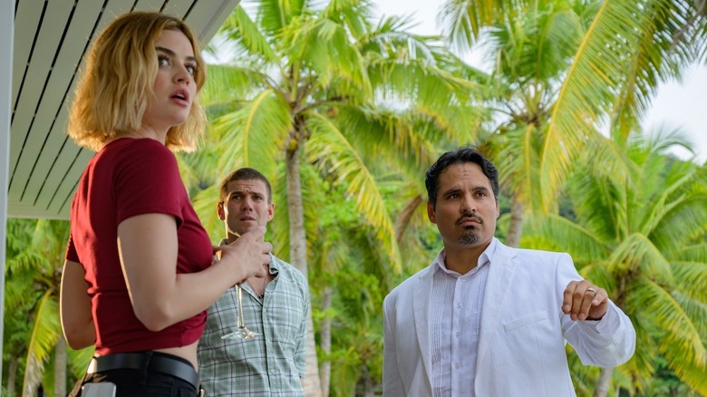 Melani Cole recieving instructions from Mr. Roarke in Fantasy Island (2020)