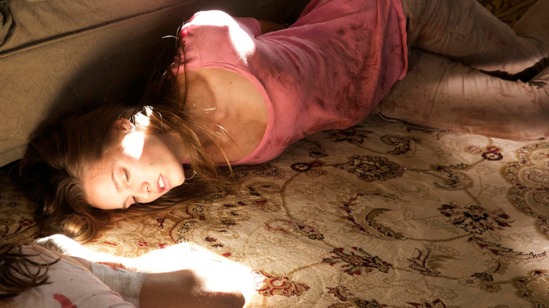 Lucie Jurin tied up and unconscious in Martyrs (2015)
