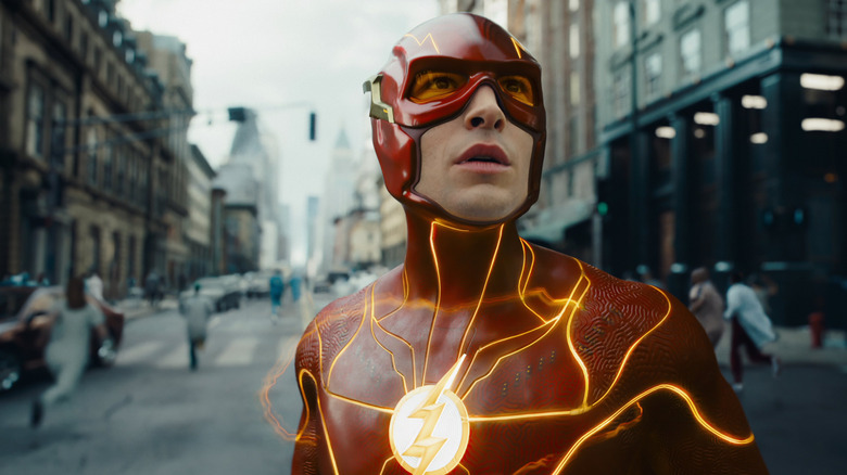 The Flash in costume on a city street in The Flash (2023)