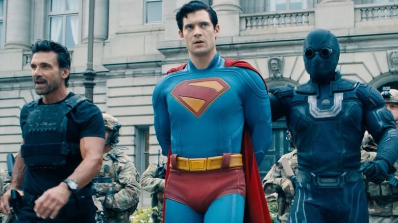 General Rick Flag Sr. and Ultraman bring Superman into custody in Superman (2025)