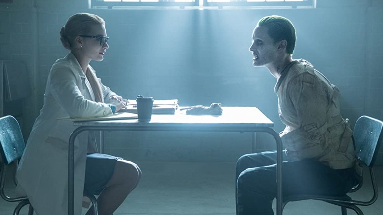 Doctor Harleen Quinzel sitting next to the Joker in Suicide Squad (2016)