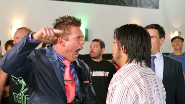 The Miz yelling at a man in stripped shirt in H8R (2011)