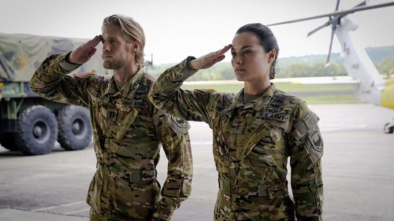 Two of the Valor lead characters doing a salute (2017)